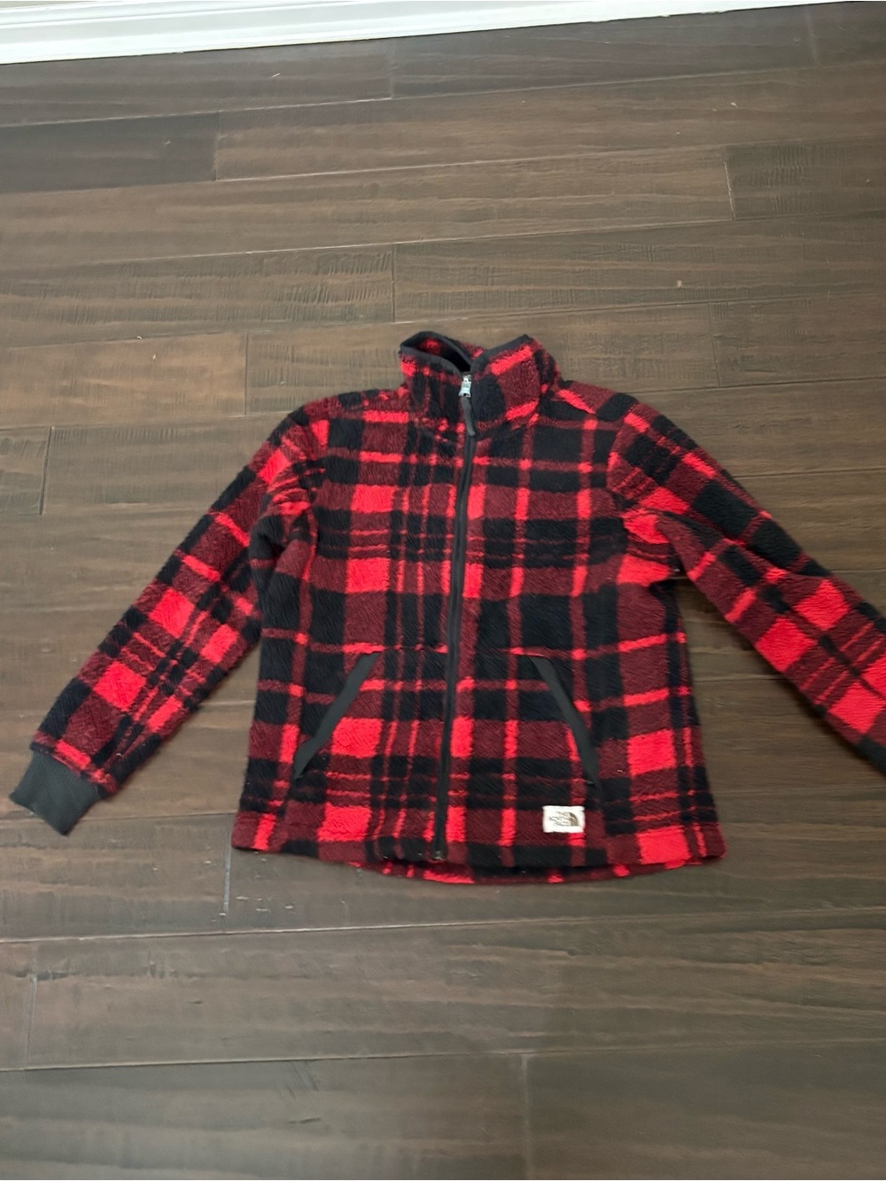 The North Face women’s Red and Black Plaid Fleece Jacket